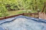 Take a dip in the hot tub with river views